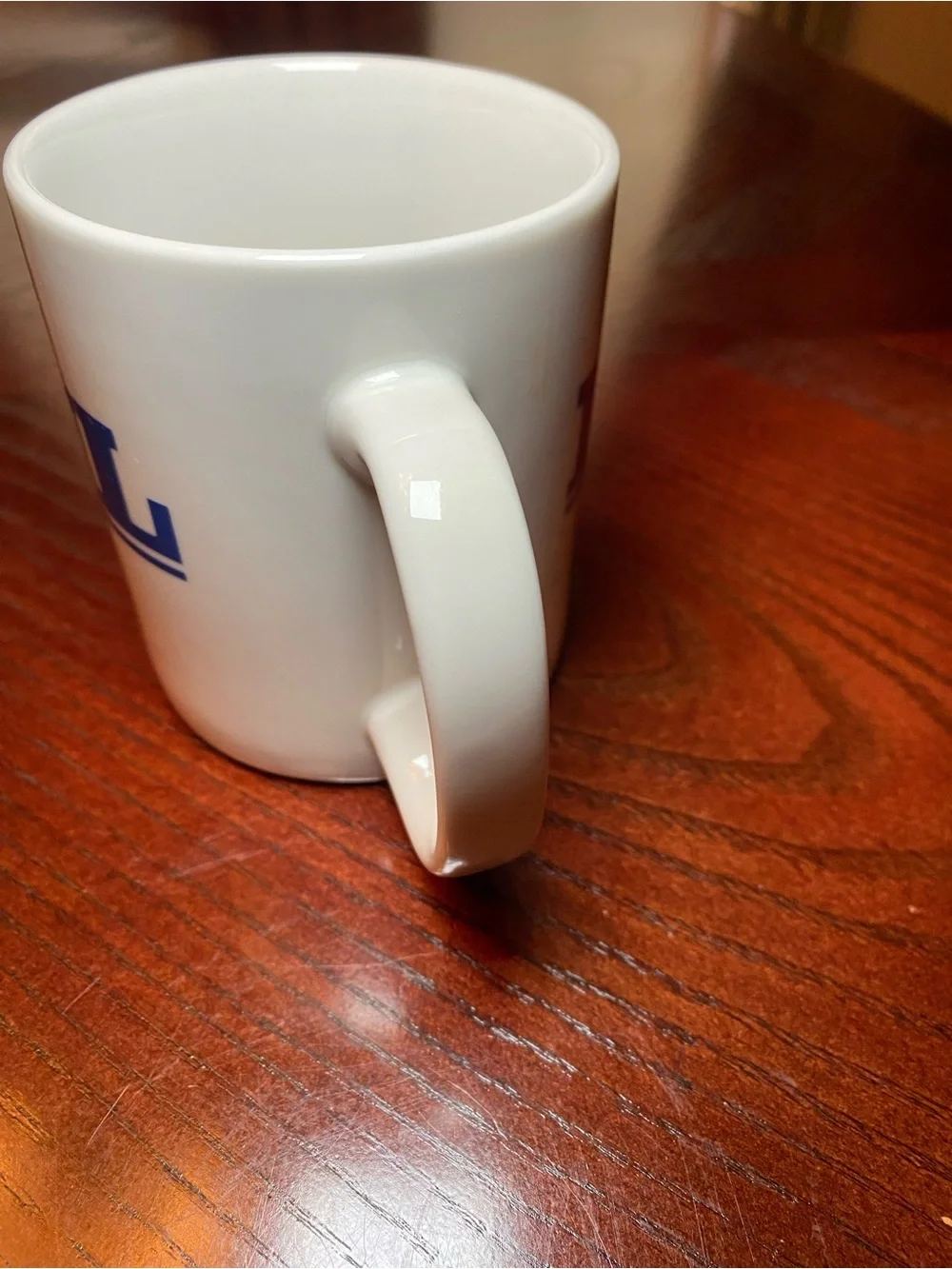 White Ceramic Coffee Mug with Blue KVIL Radio Logo. 10 Oz